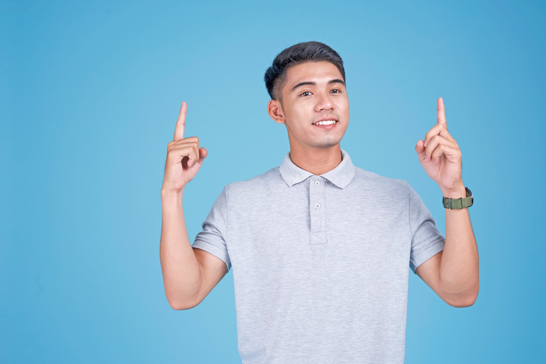 Handsome Student with Smart Watch on Light Blue Background